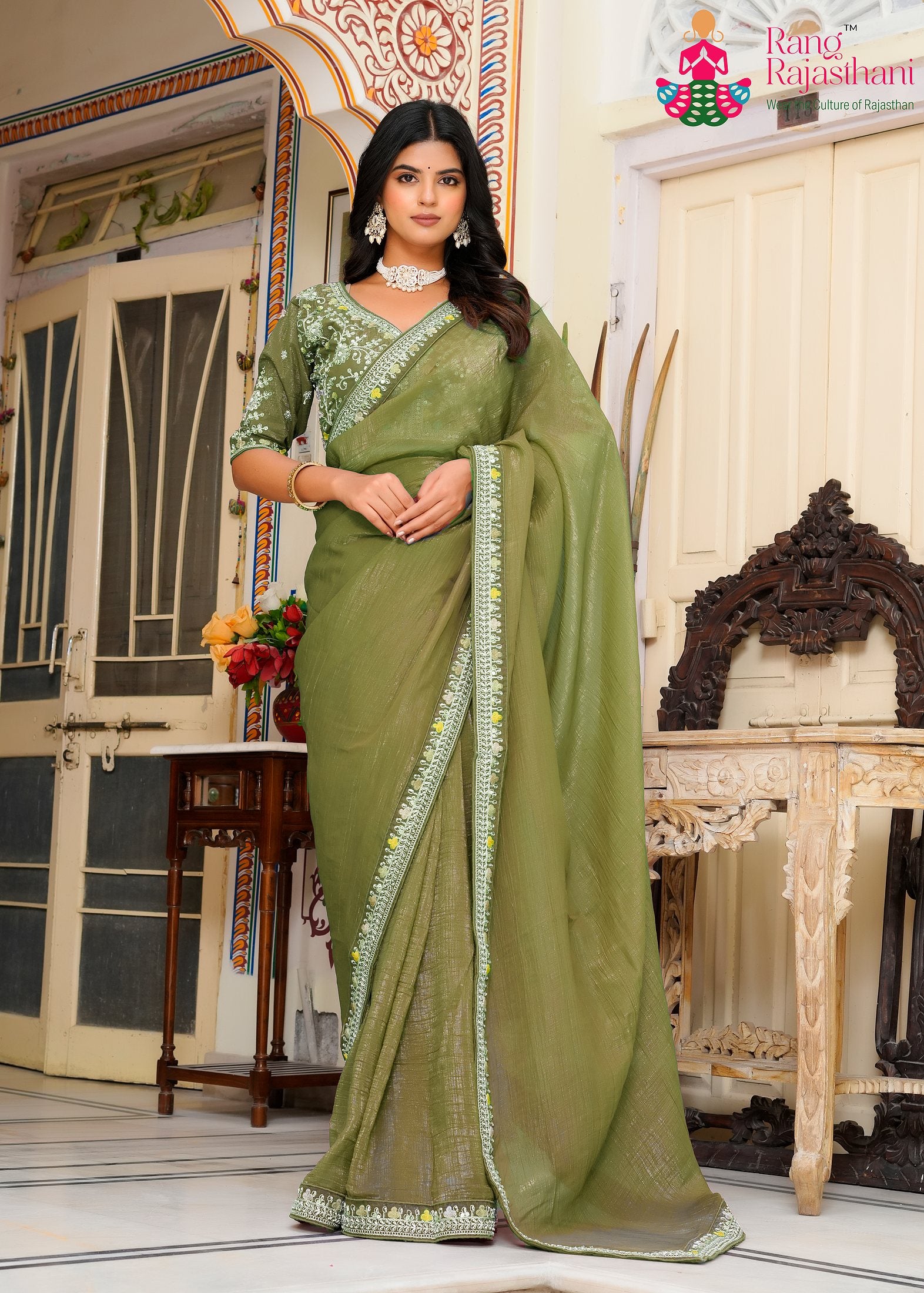 close up detailing of artisanal mehandi fabric saree 