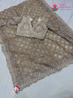pallu detailing of beige net sequin saree 