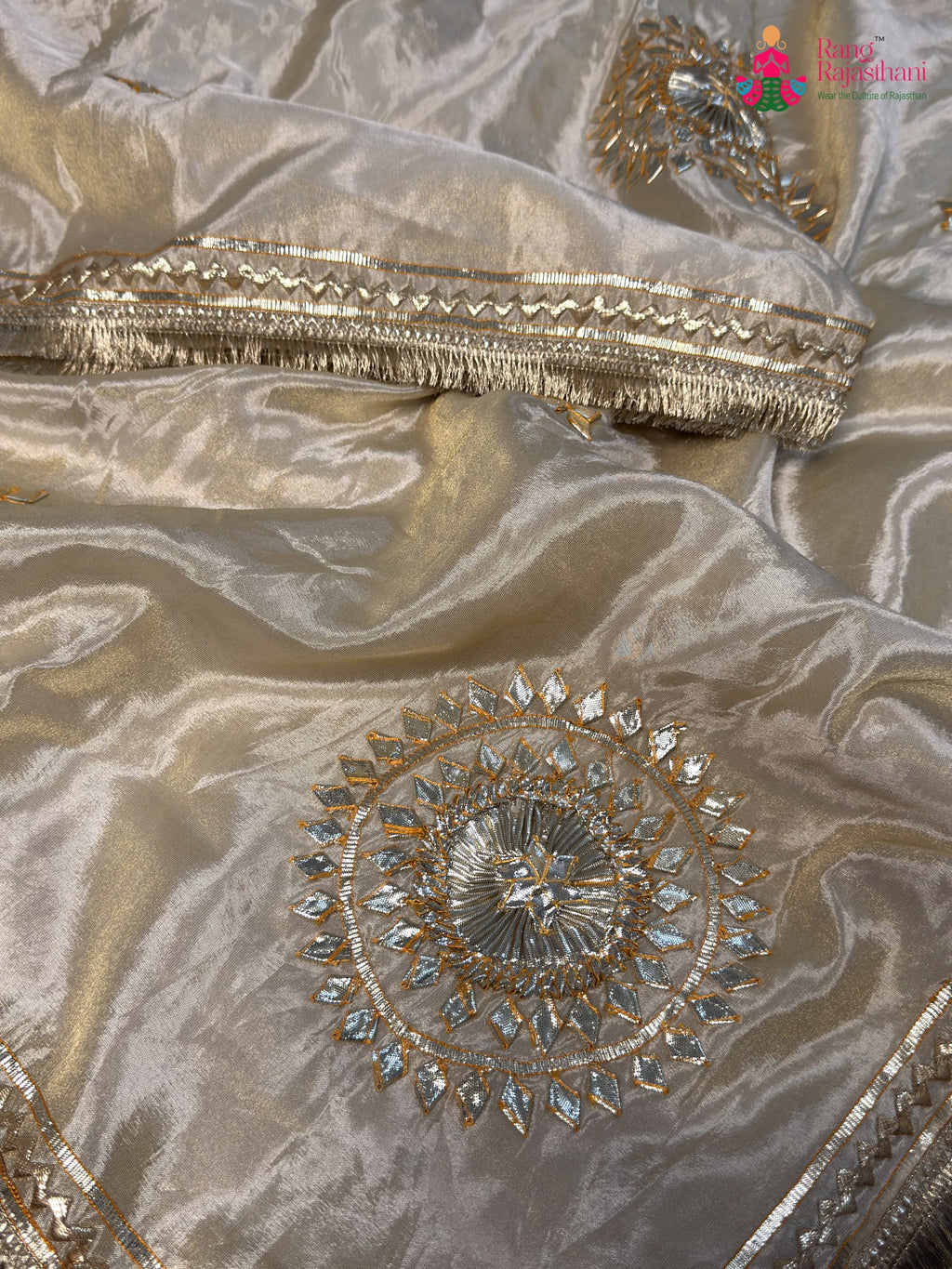 fabric texture of beige pure tissue silk gota patti saree
