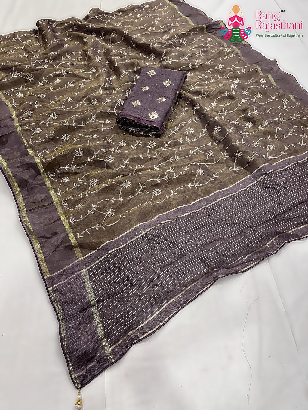 close up detailing of beige pure tissue silk zari embroidery saree 