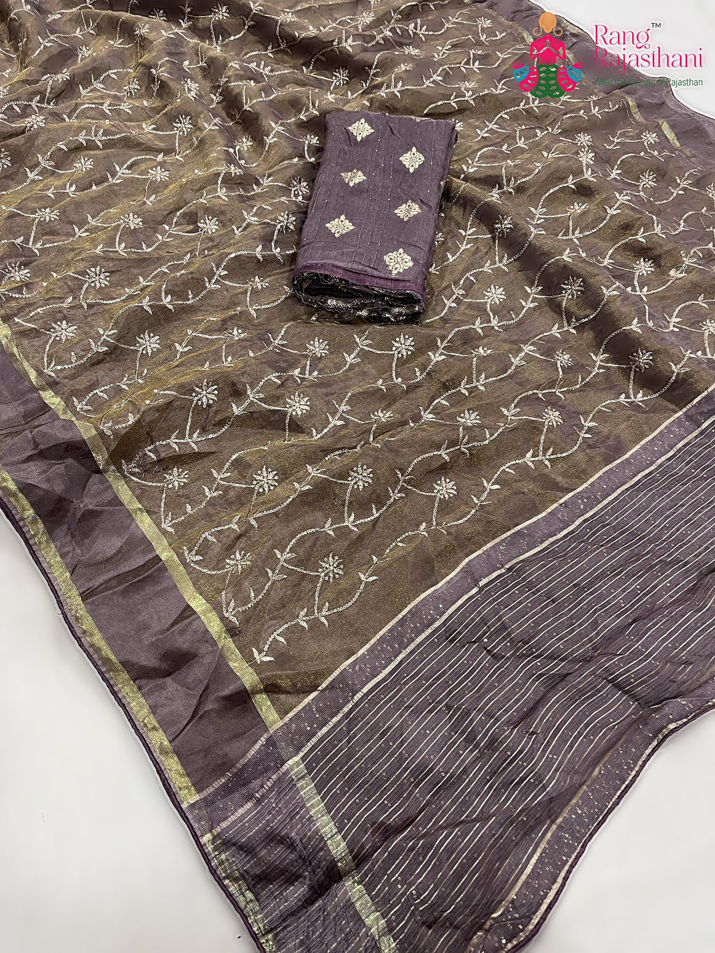 pallu detailing of beige pure tissue silk zari embroidery saree 