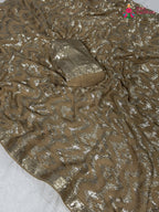 close up detailing of beige synthetic hand embellishment saree