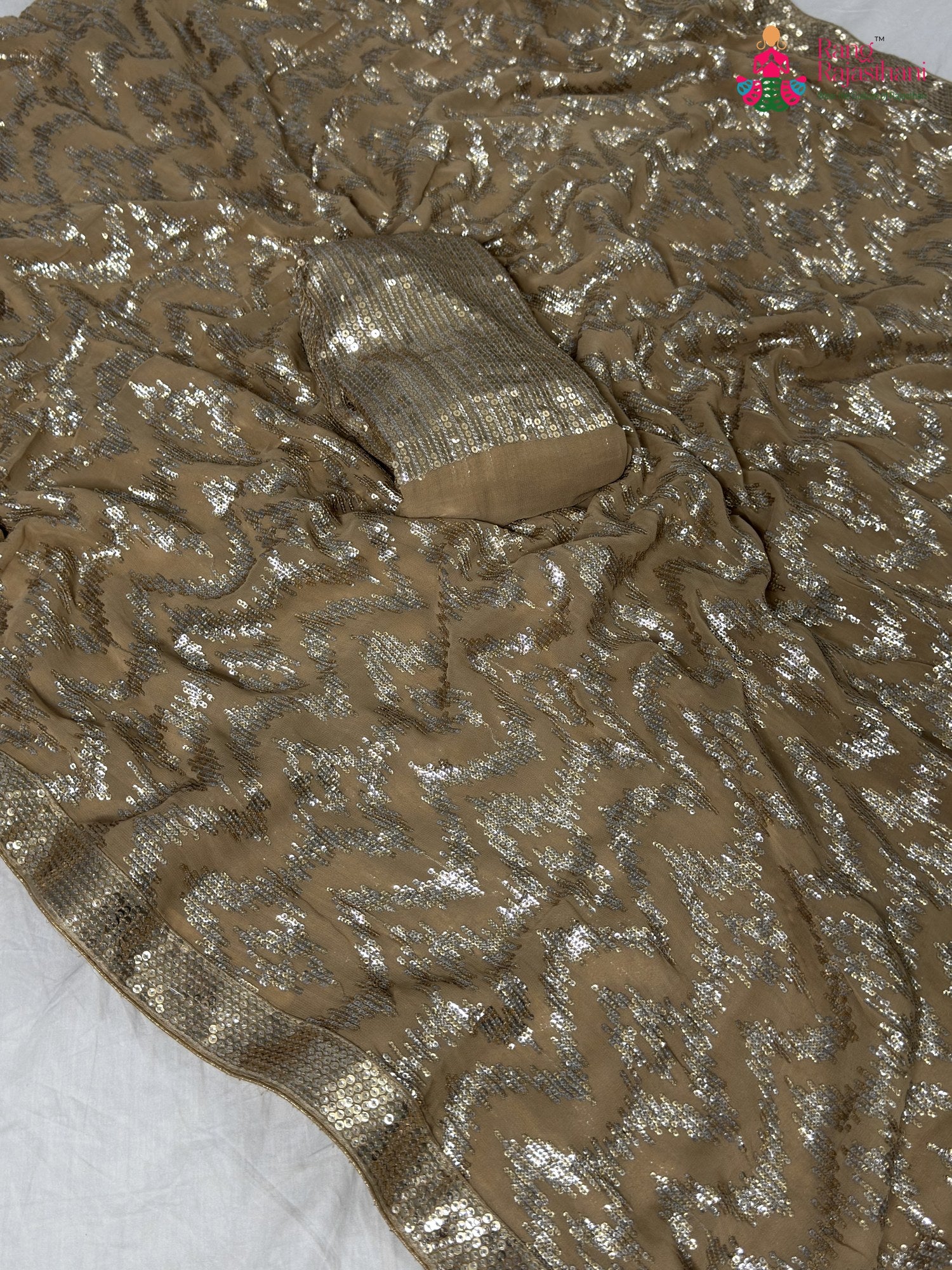 close up detailing of beige synthetic hand embellishment saree
