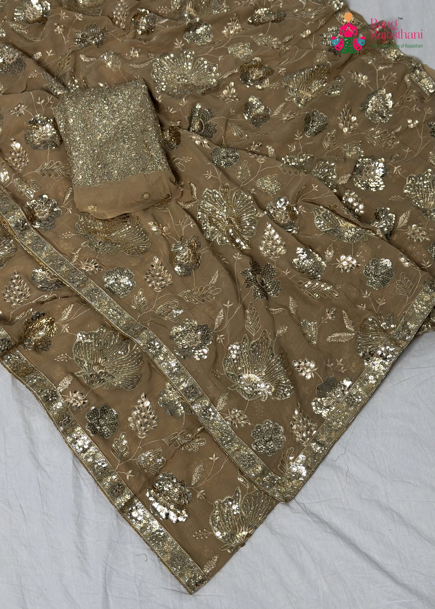 border detailing of beige synthetic sequin saree