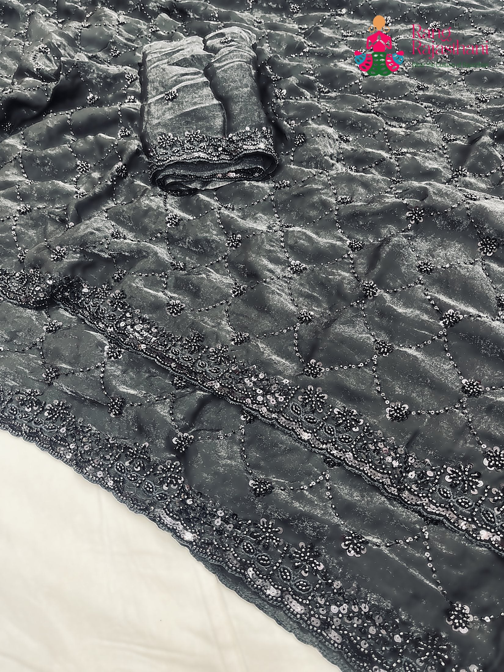 close up detailing of black art silk sequin saree 