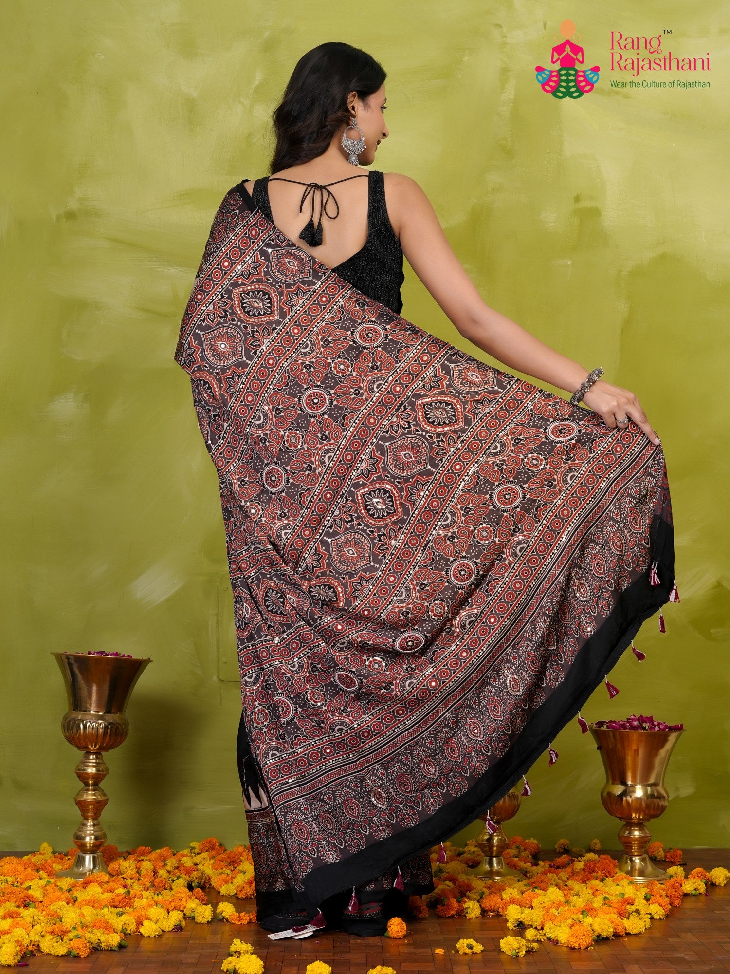 border detail of black modal ajrakh print saree