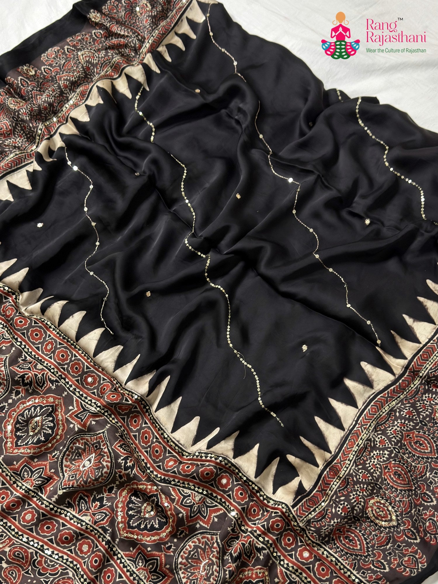 color and weave of black modal ajrakh print saree