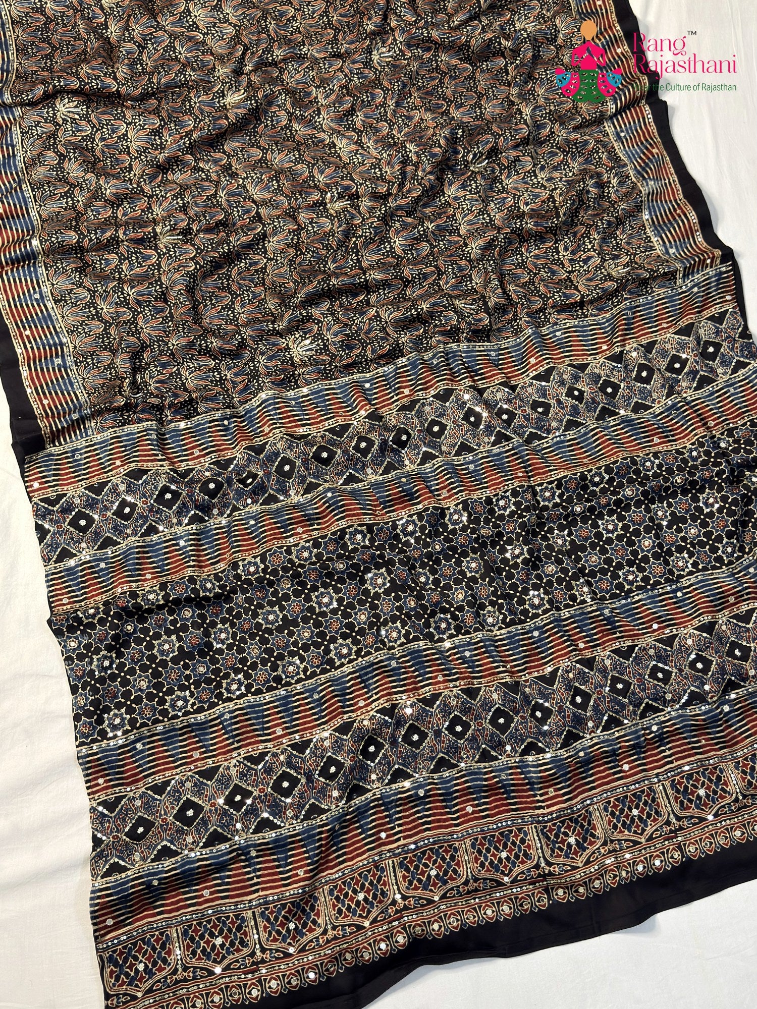color and weave of black modal ajrakh print saree