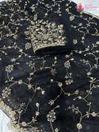 close up detailing of black net hand embellishment saree