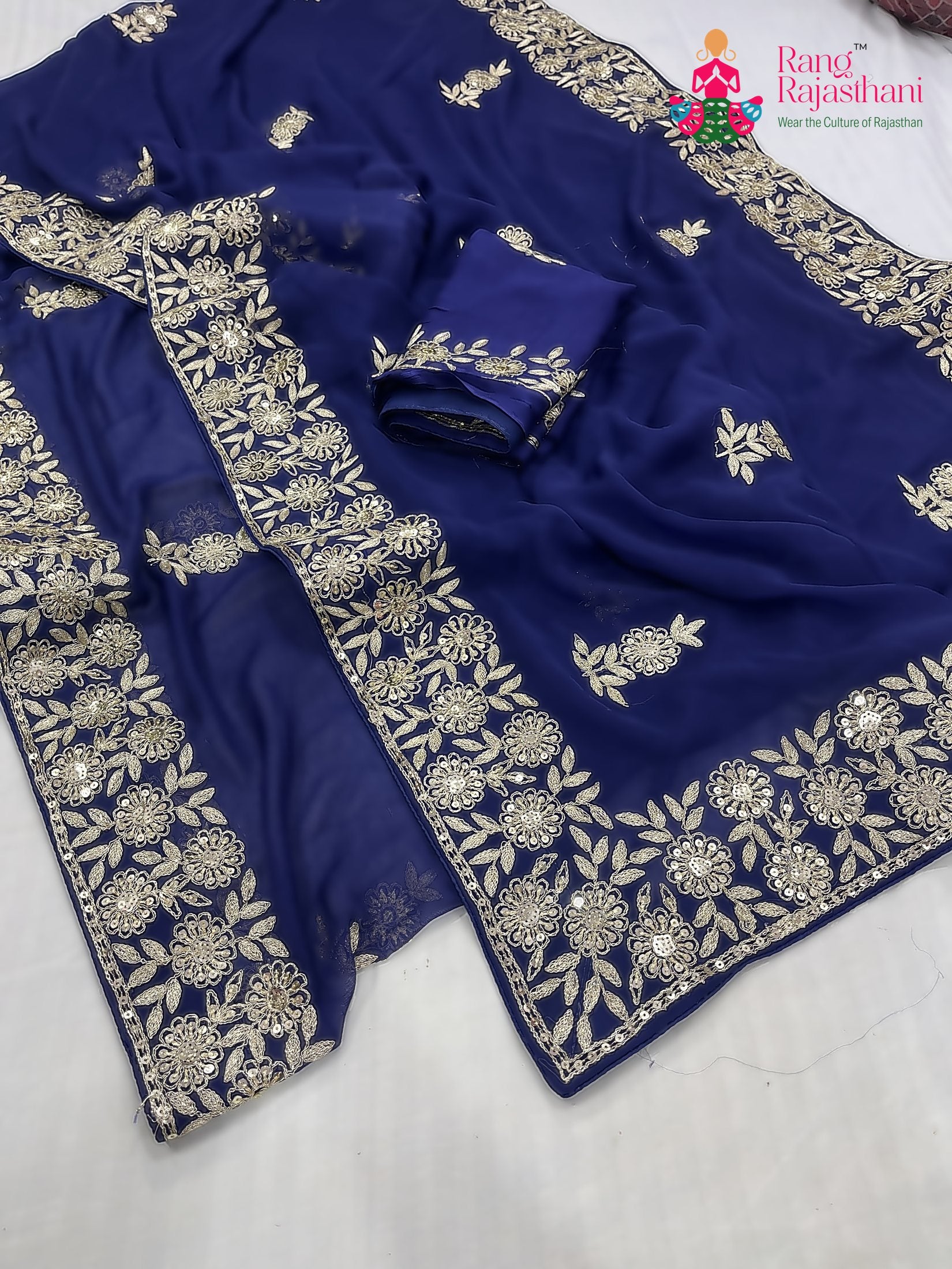 border detailing of blue chiffon zari embroidery saree