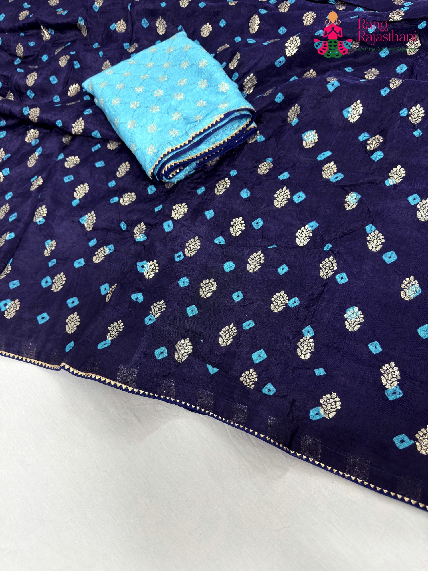close up detailing of blue pure dola silk bandhani saree