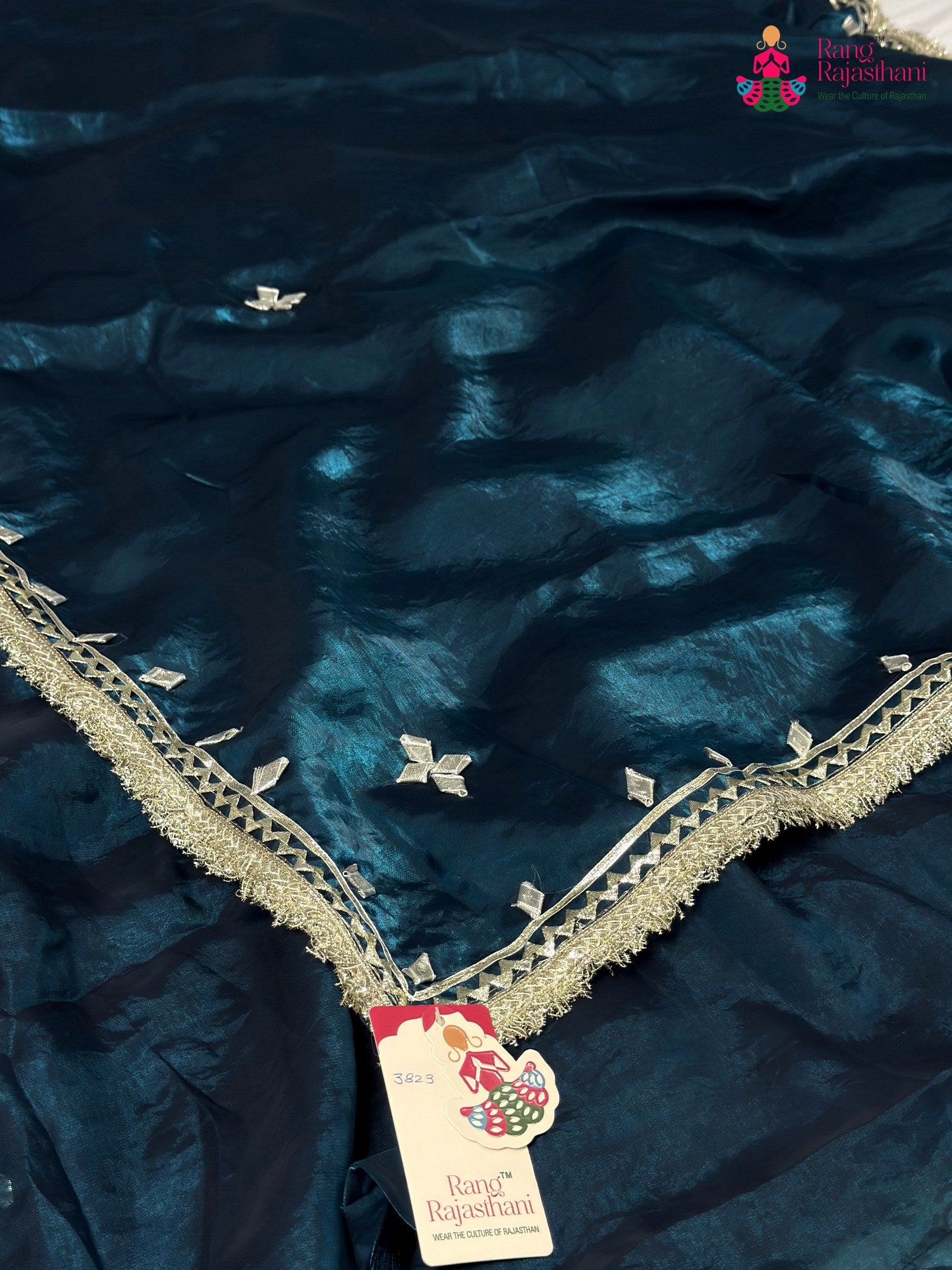 pallu detailing of blue synthetic gota patti saree
