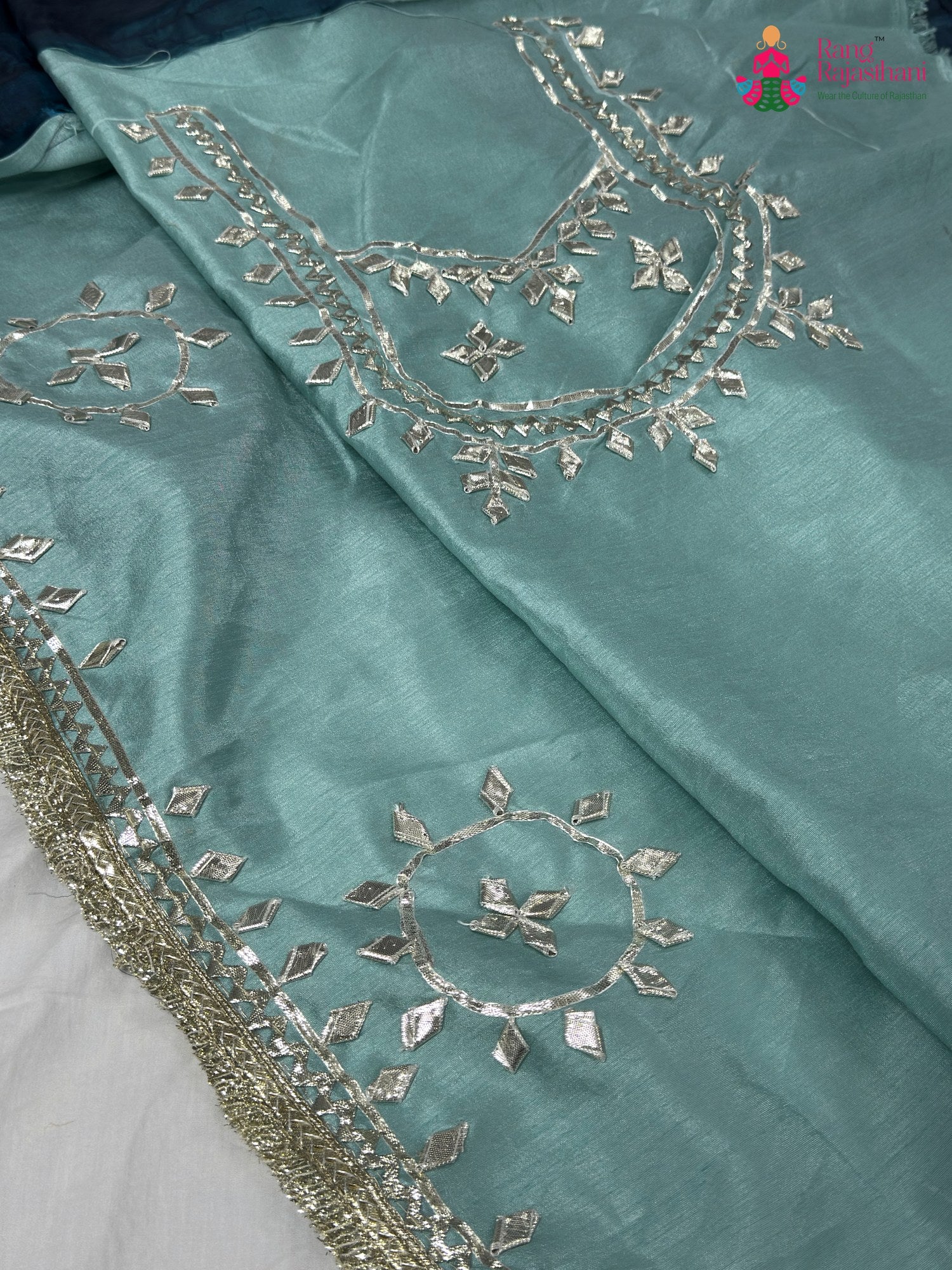 design pattern of blue synthetic gota patti saree