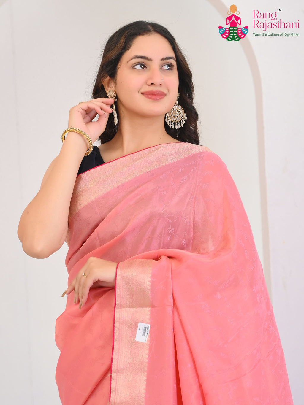 blush pink pure silk saree with jacquard texture for office close-up view