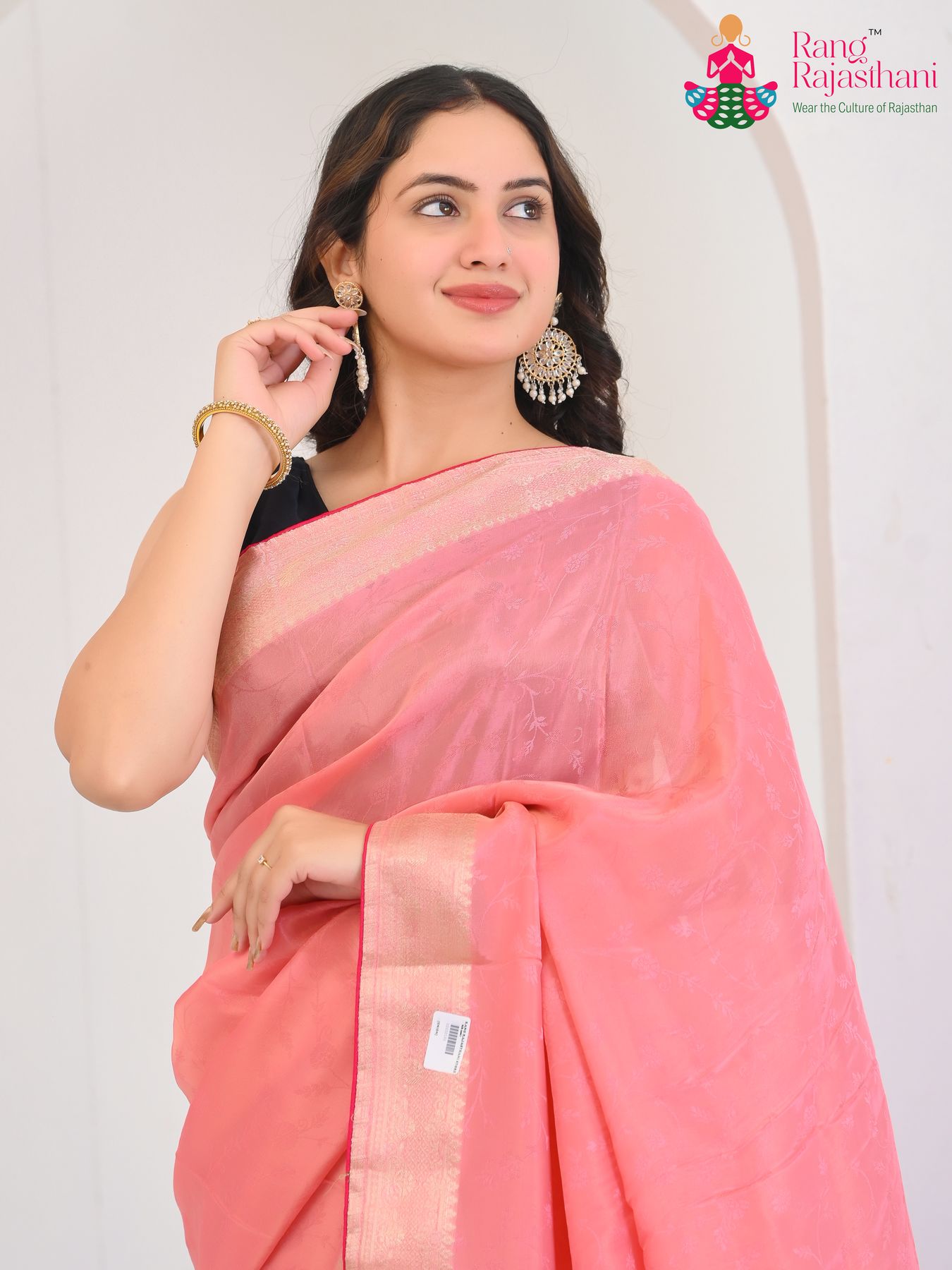 blush pink pure silk saree with jacquard texture for office close-up view