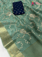 work detailing of breathable see green chinnon saree