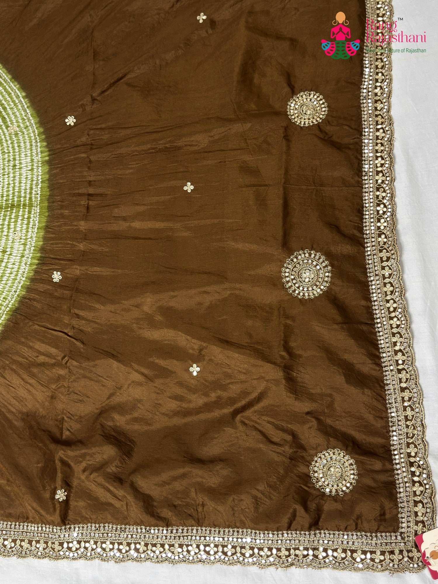 color and weave of brown pure ho silk hand embellishment saree