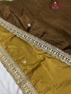 intricate detail of brown pure ho silk hand embellishment saree