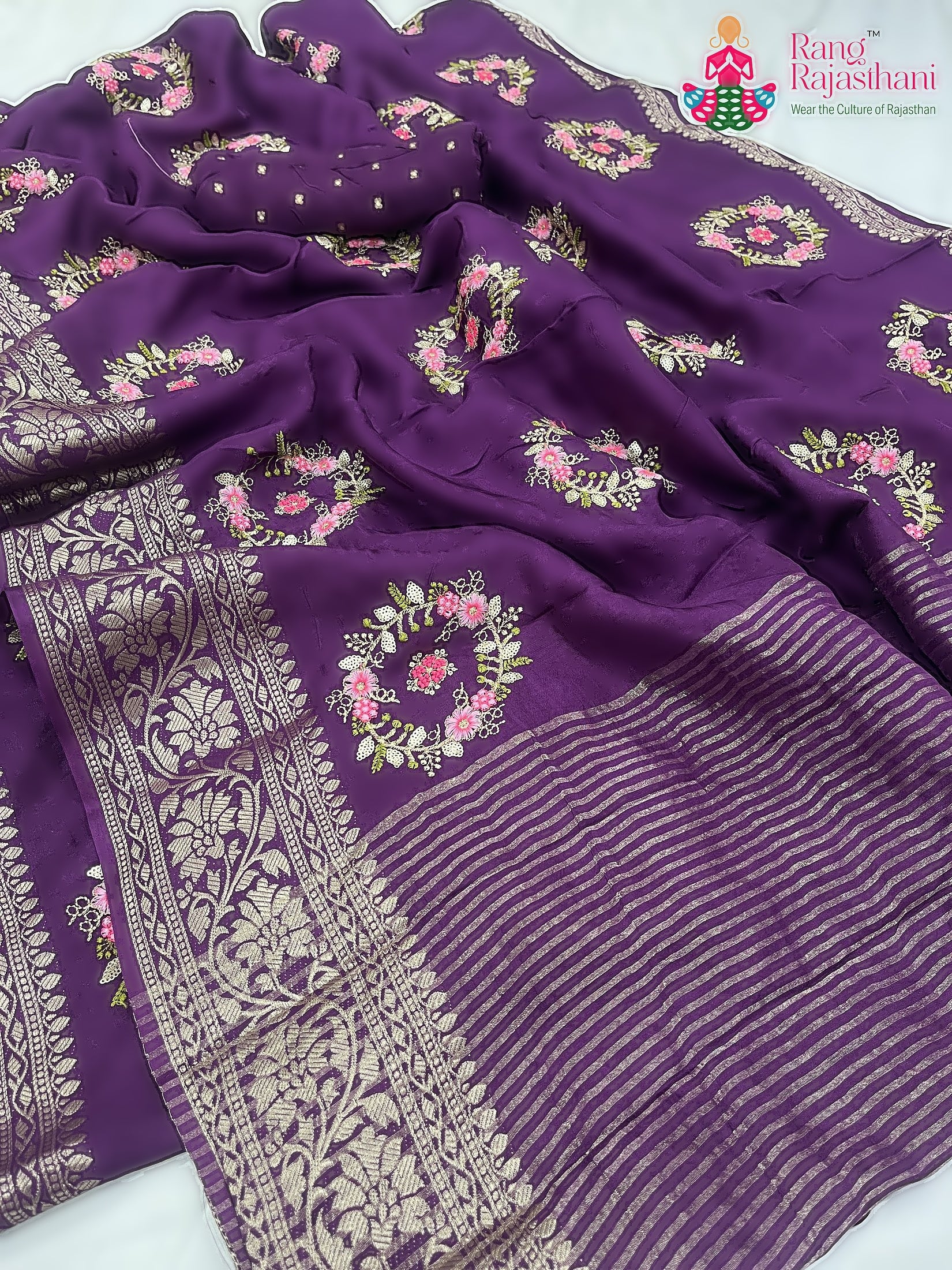 close up detailing of burgundy pure Russian silk resham embroidery saree 
