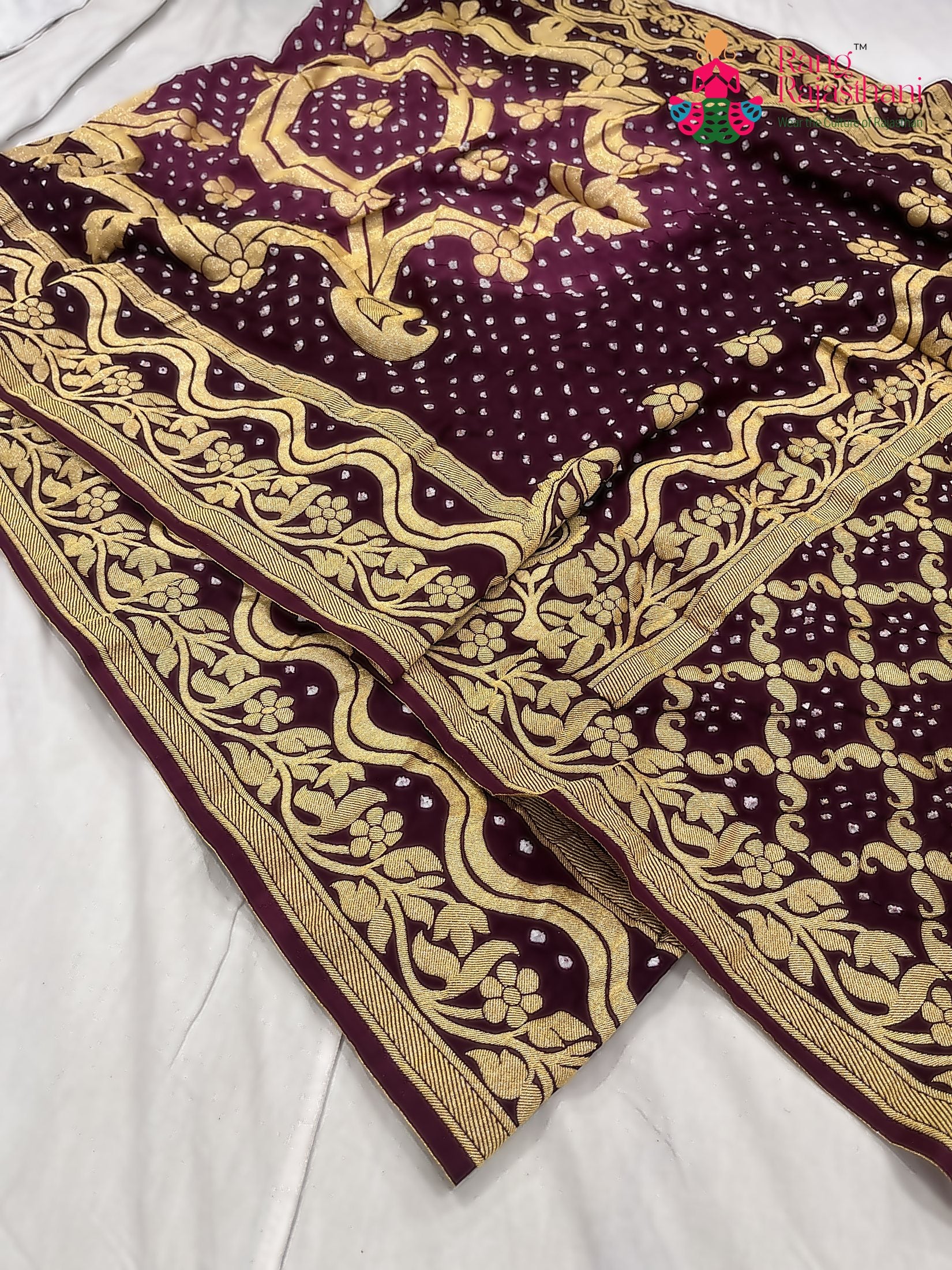 close up detailing of burgundy saree 