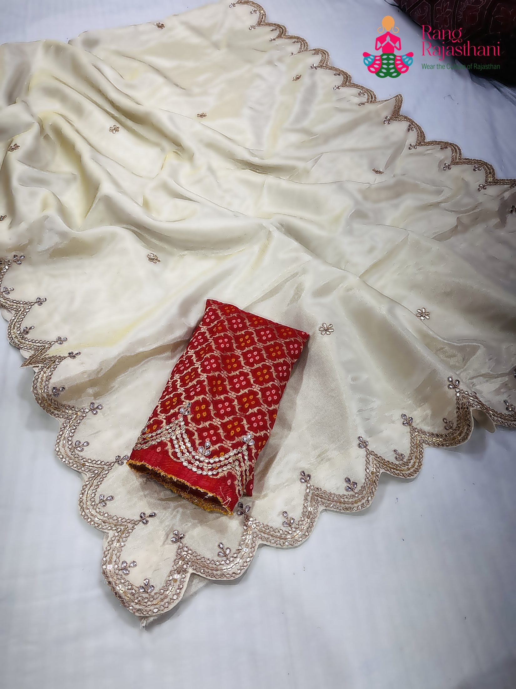 border detailing of cream pure tissue silk gota patti saree