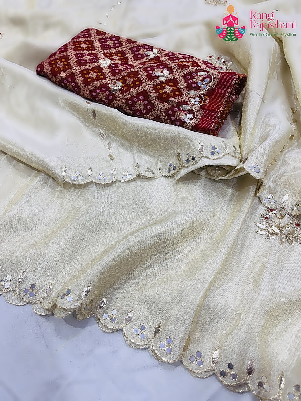 close up detailing of cream pure tissue silk gota patti saree 