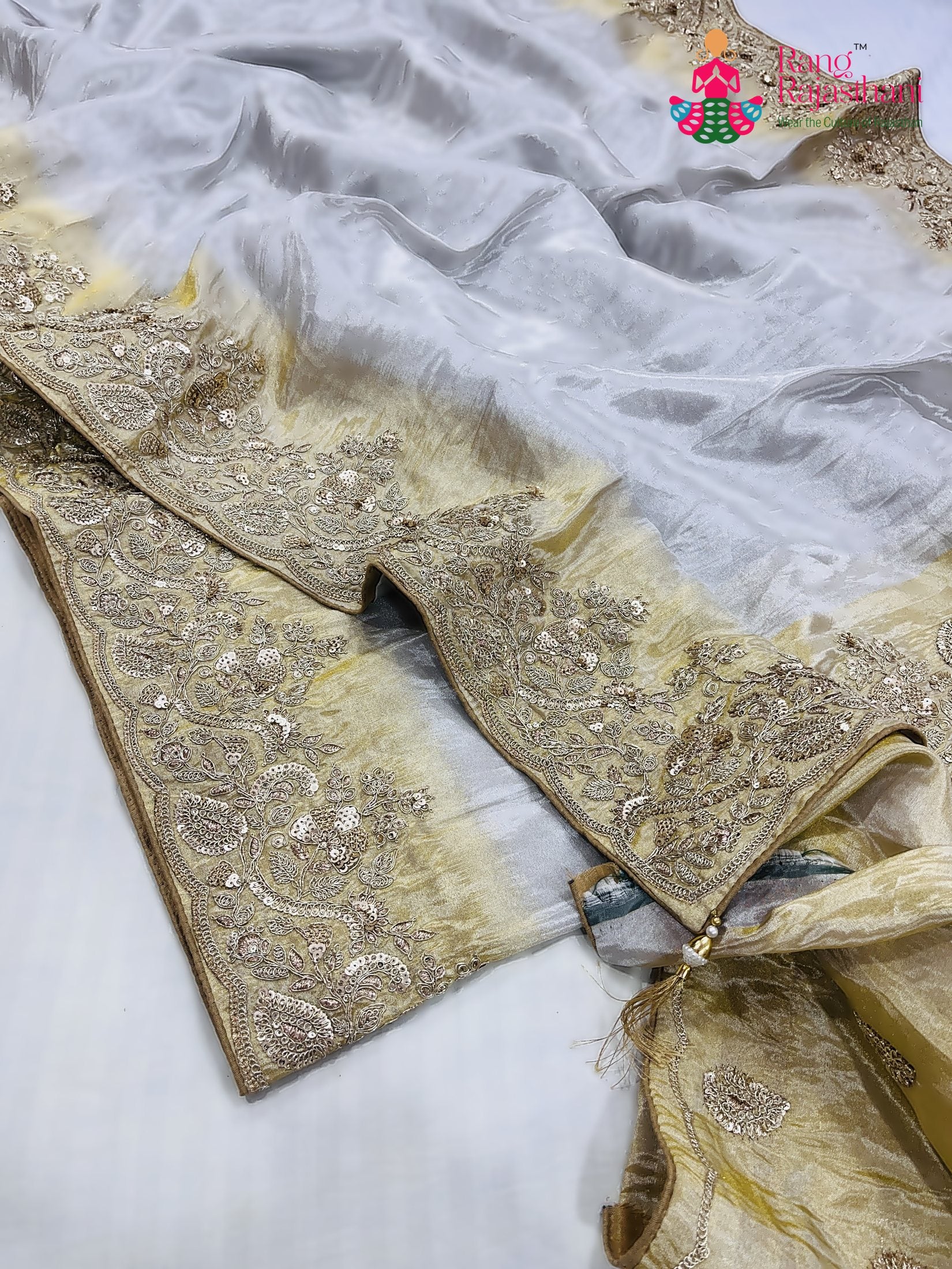 pallu detailing of cream pure tissue silk zari embroidery saree