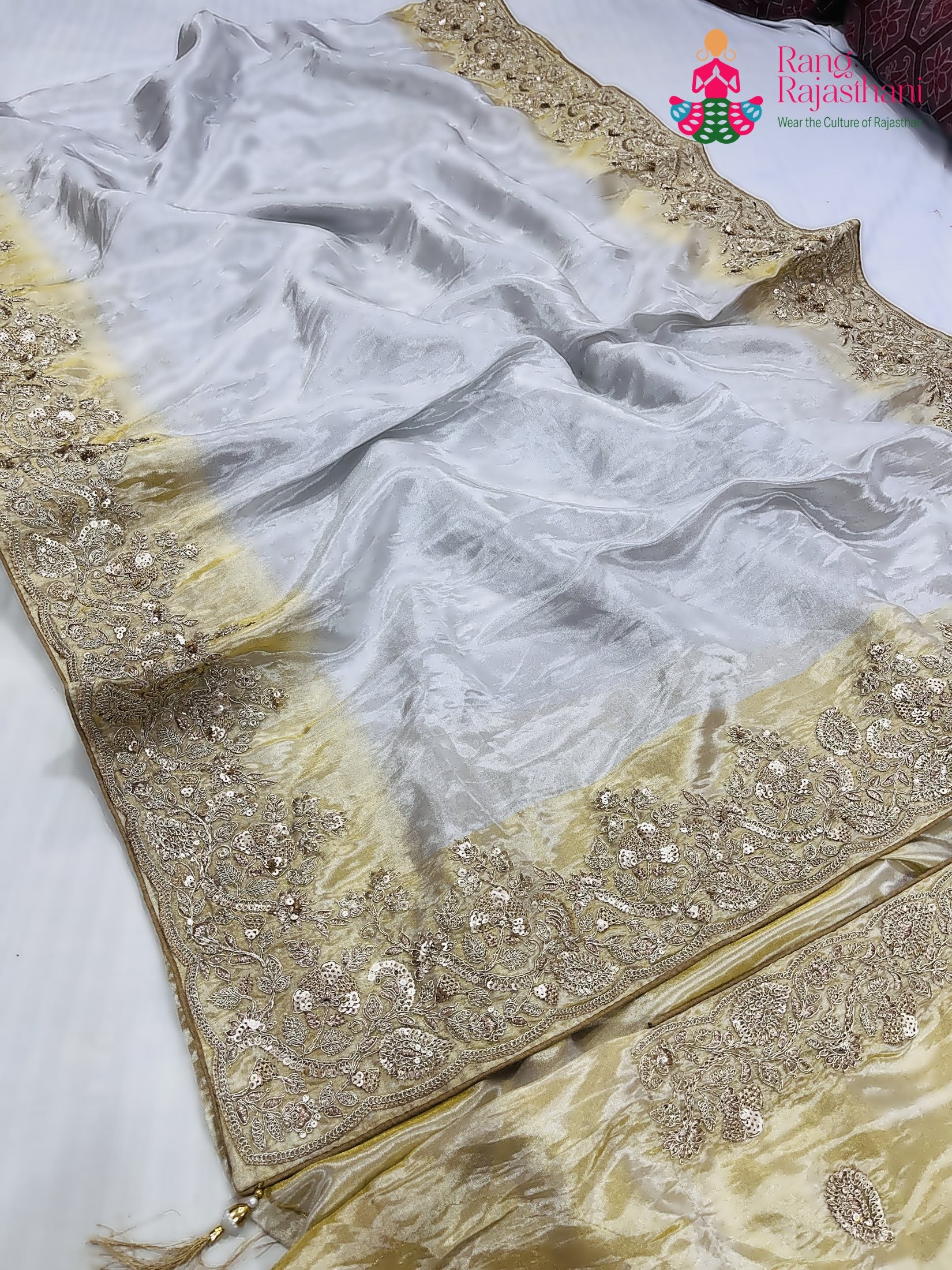 close up detailing of cream pure tissue silk zari embroidery saree