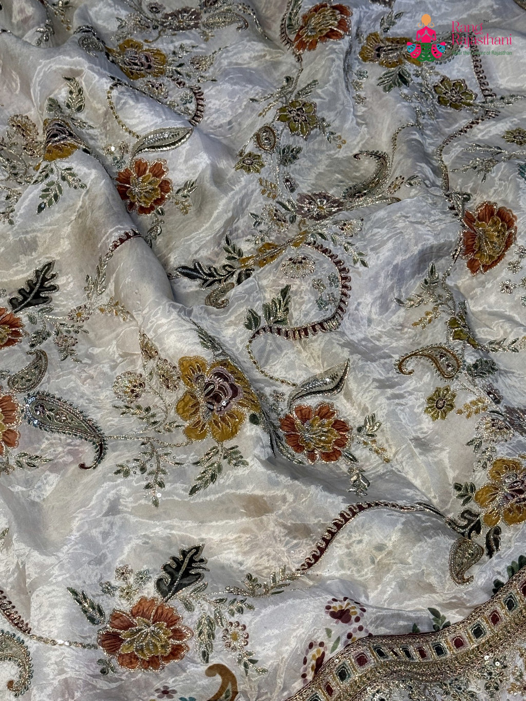 pallu detailing of cream pure tissue silk zari embroidery saree