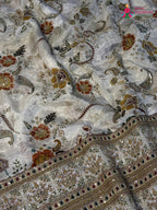 close up detailing of cream pure tissue silk zari embroidery saree