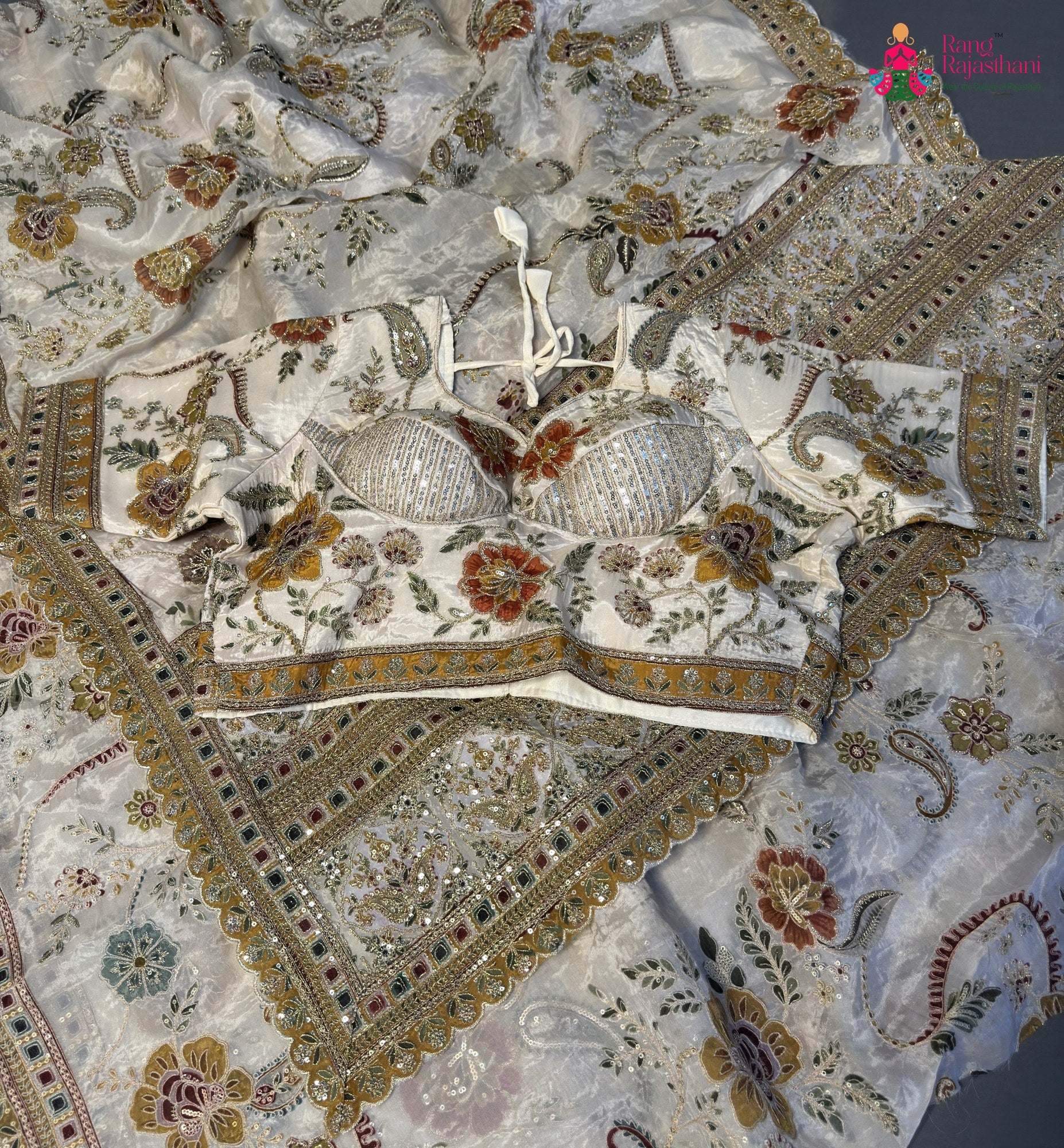 complete look of cream pure tissue silk zari embroidery saree