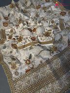 border detailing of cream pure tissue silk zari embroidery saree