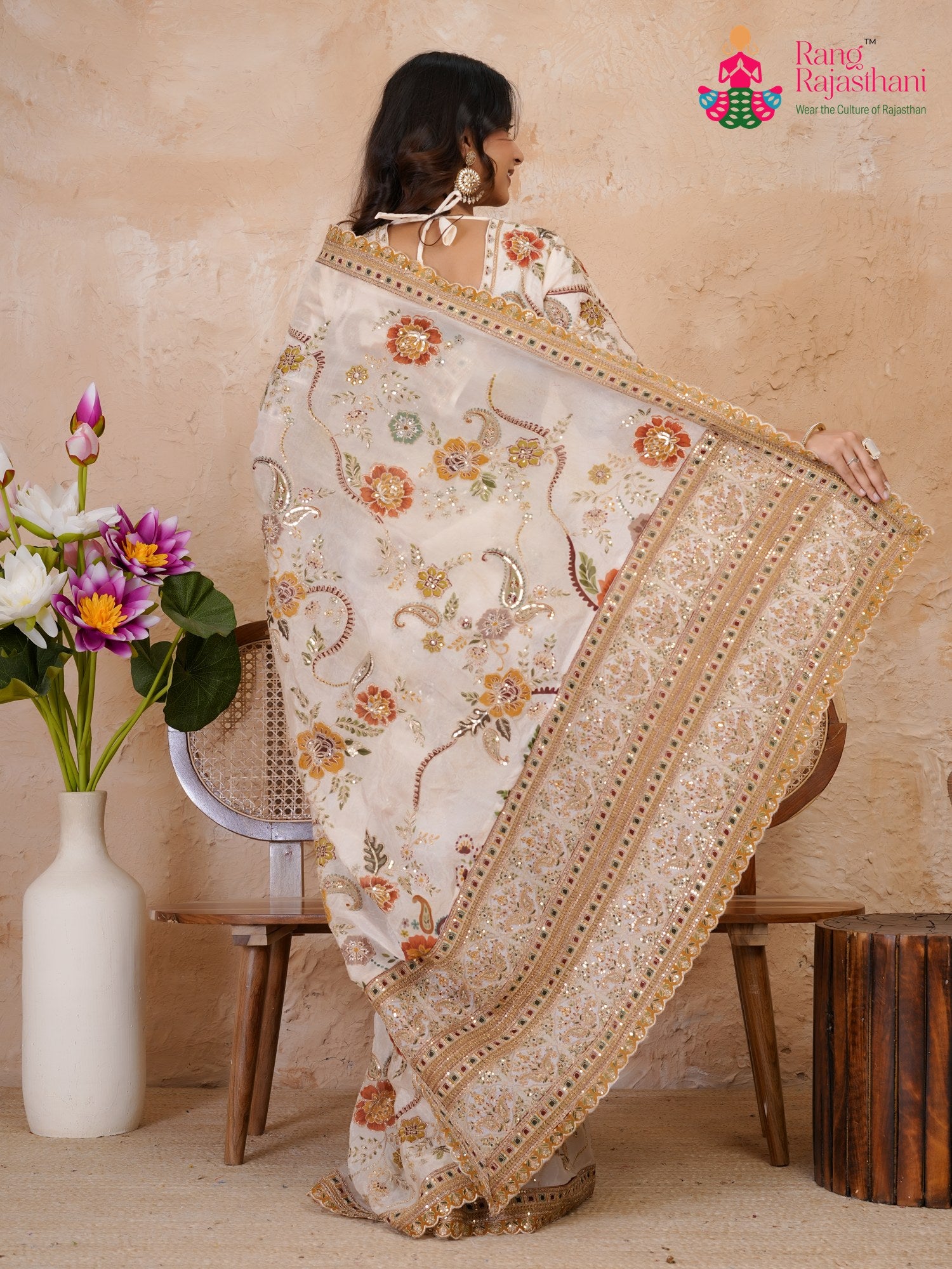 border detail of cream pure tissue silk zari embroidery saree