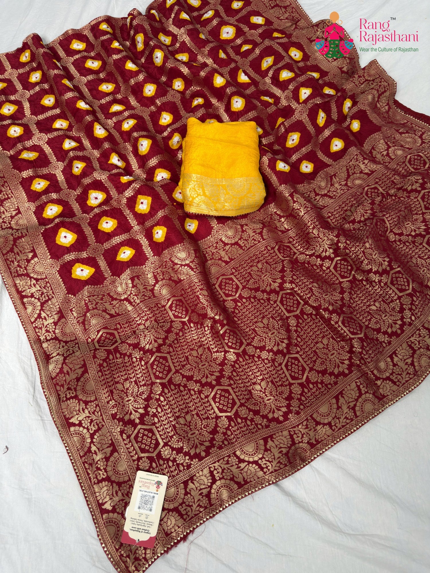 border detailing of crimson red pure dola silk bandhej banarasi zari saree