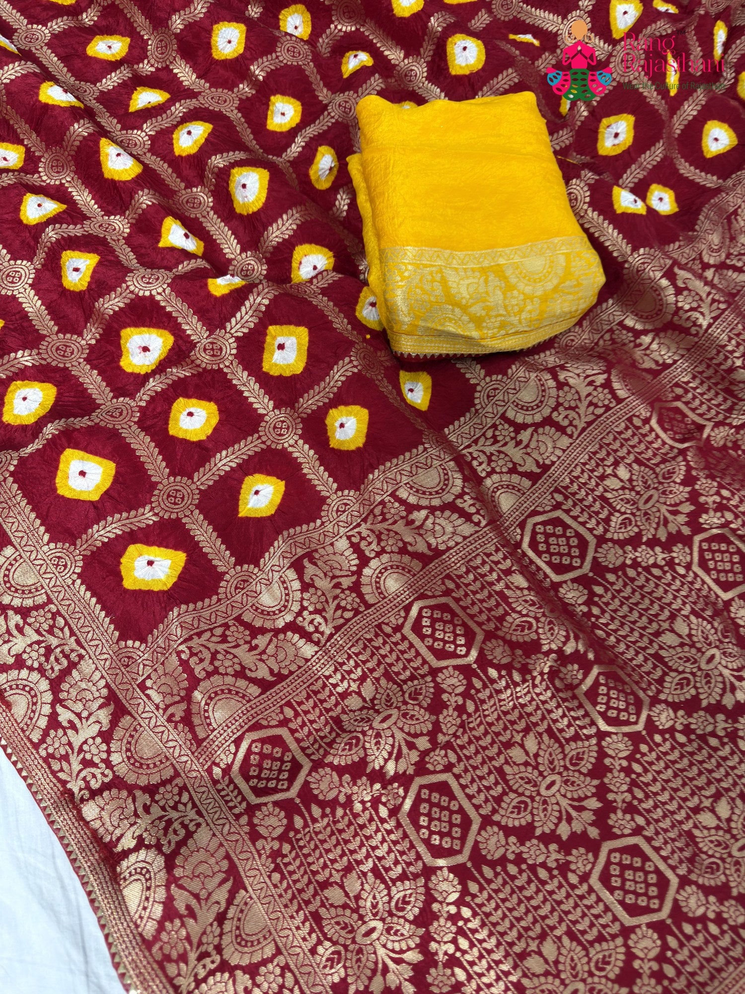 fabric texture of crimson red pure dola silk bandhej banarasi zari saree