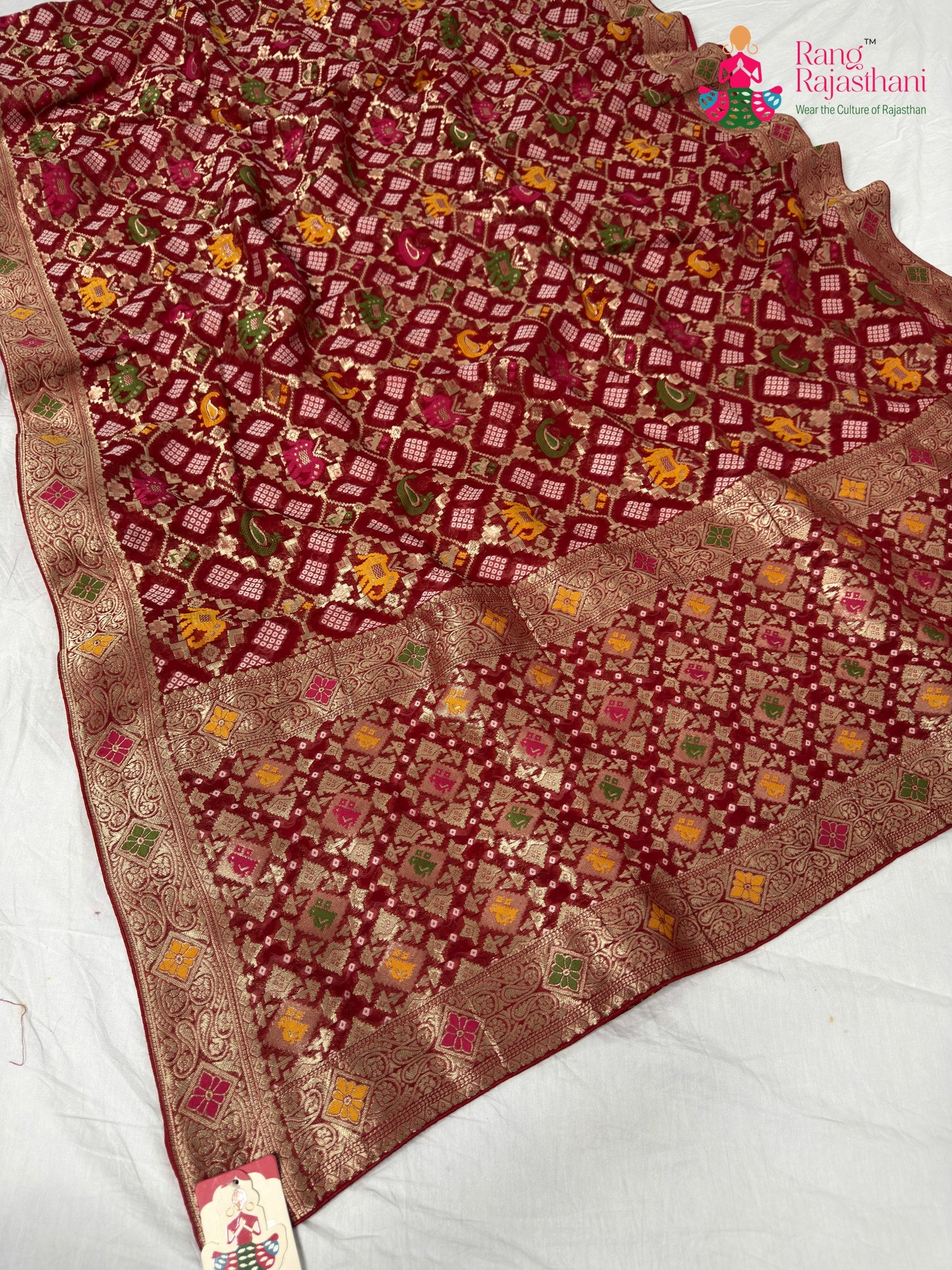 border detailing of crimson red pure georgette khaddi saree