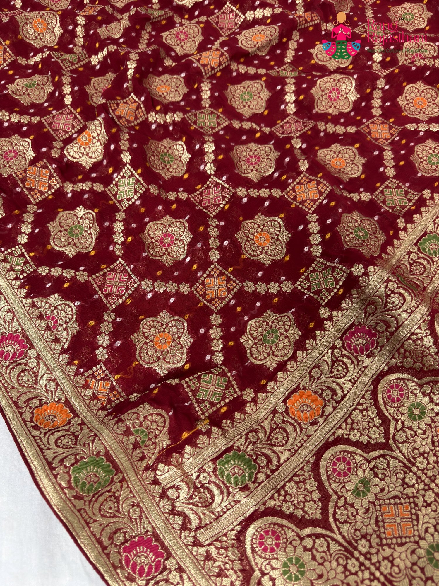 border detailing of crimson red pure georgette khaddi saree