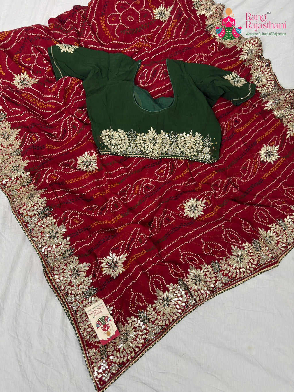 border detailing of elegant red fabric saree