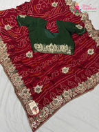 border detailing of elegant red fabric saree