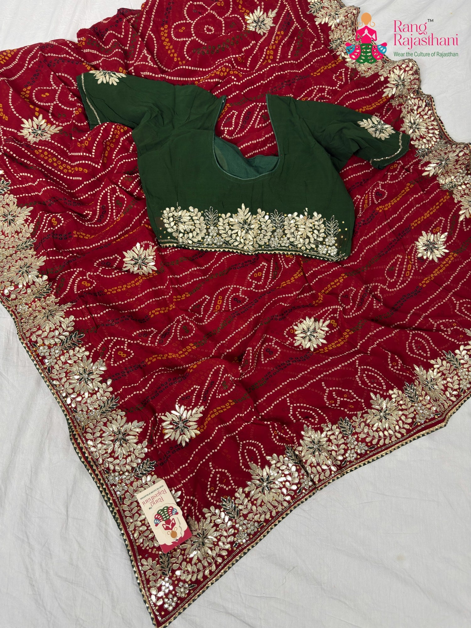 border detailing of elegant red fabric saree