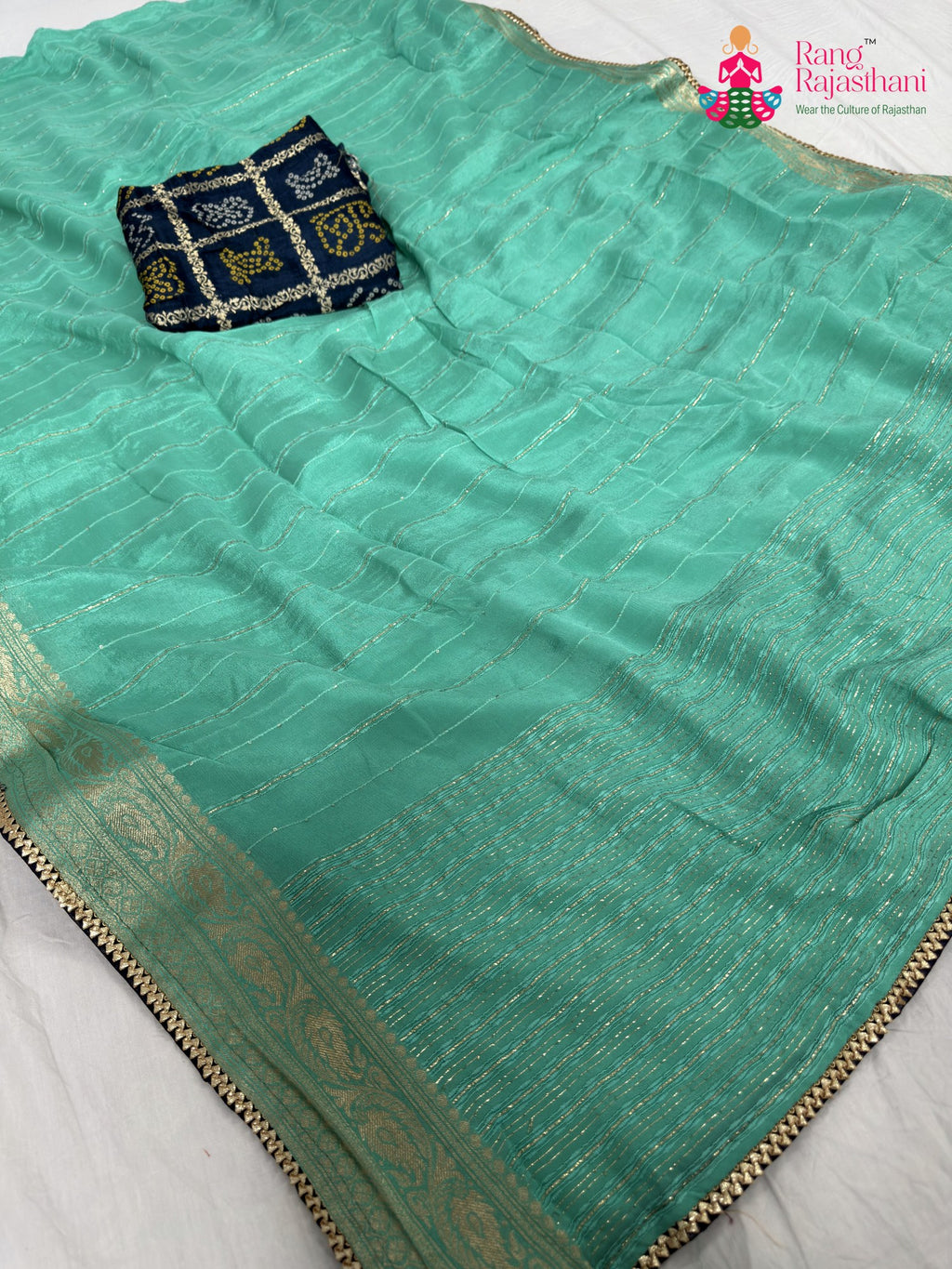 pallu detailing of firozi chinnon bandhani saree