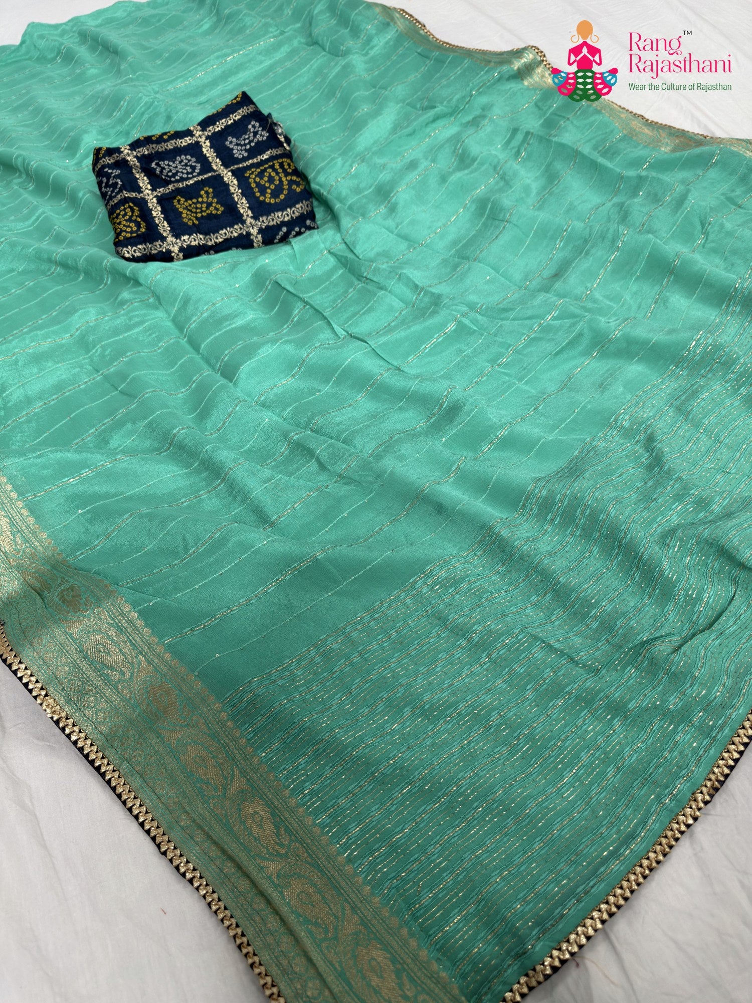 pallu detailing of firozi chinnon bandhani saree