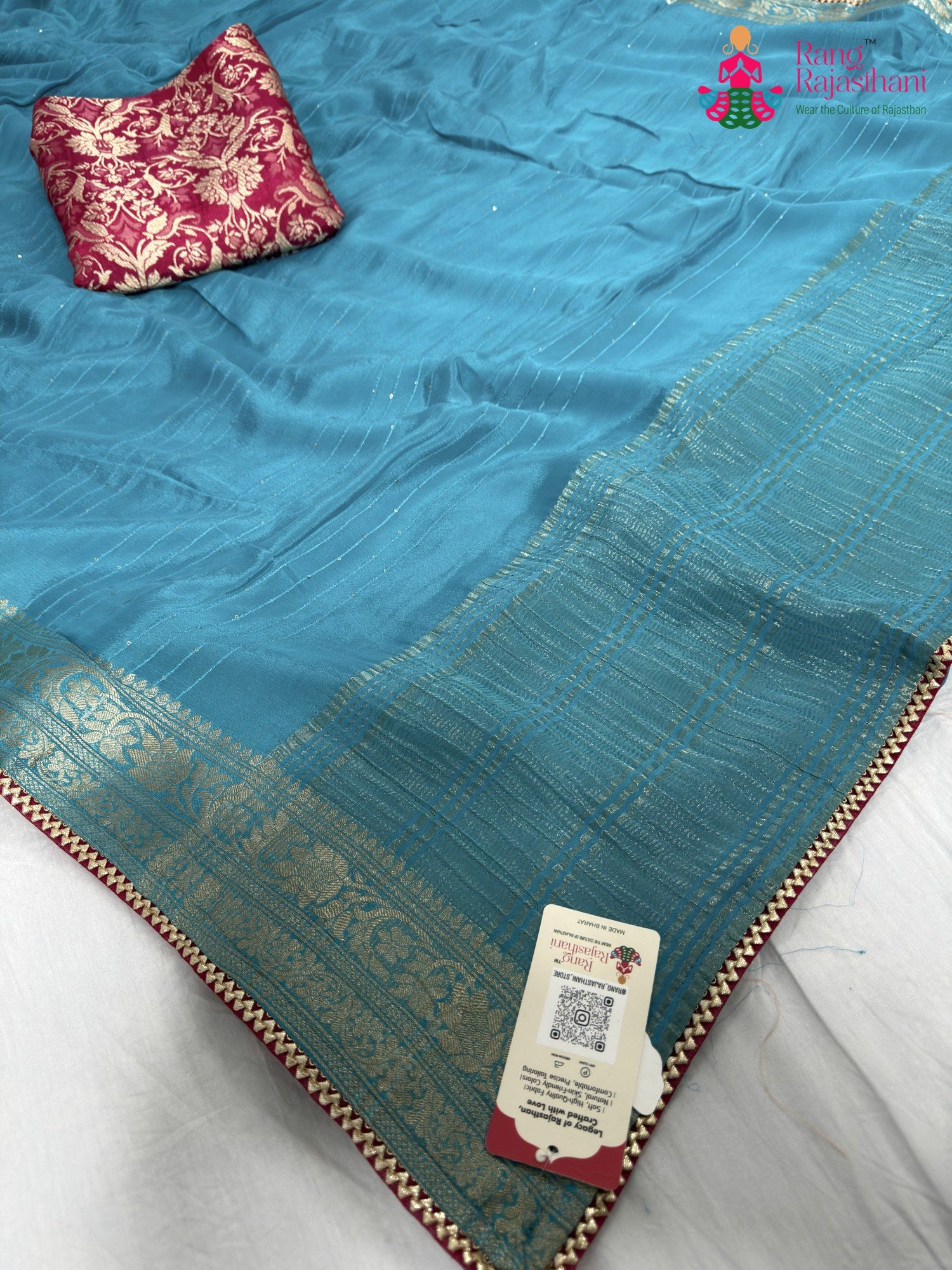 pallu detailing of firozi chinnon saree