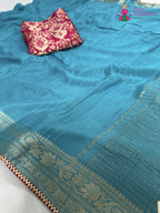 close up detailing of firozi chinnon saree