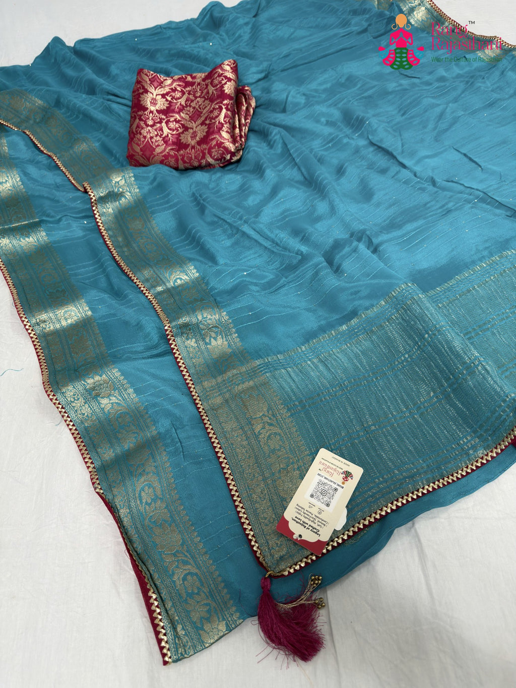 border detailing of firozi chinnon saree