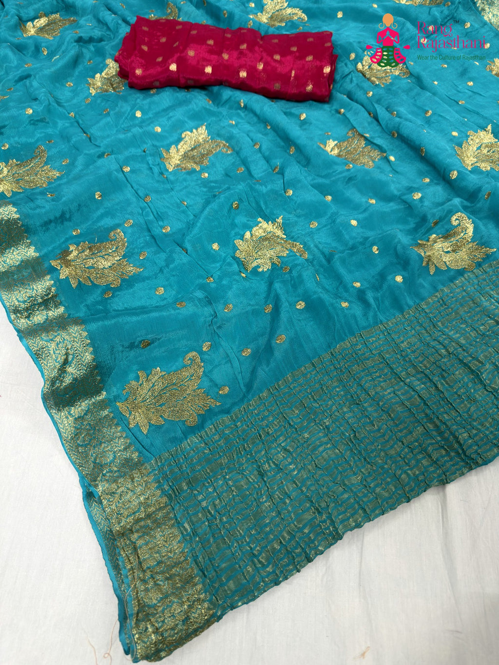 pallu detailing of firozi chinnon sequin saree