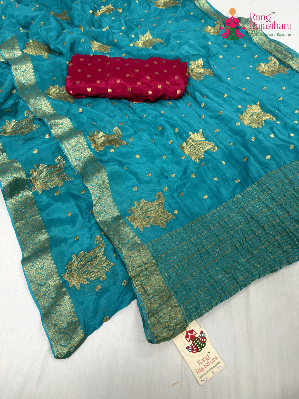 close up detailing of firozi chinnon sequin saree