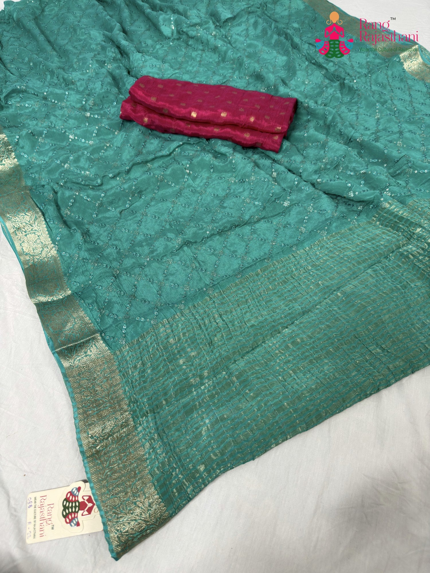 pallu detailing of firozi chinnon sequin saree