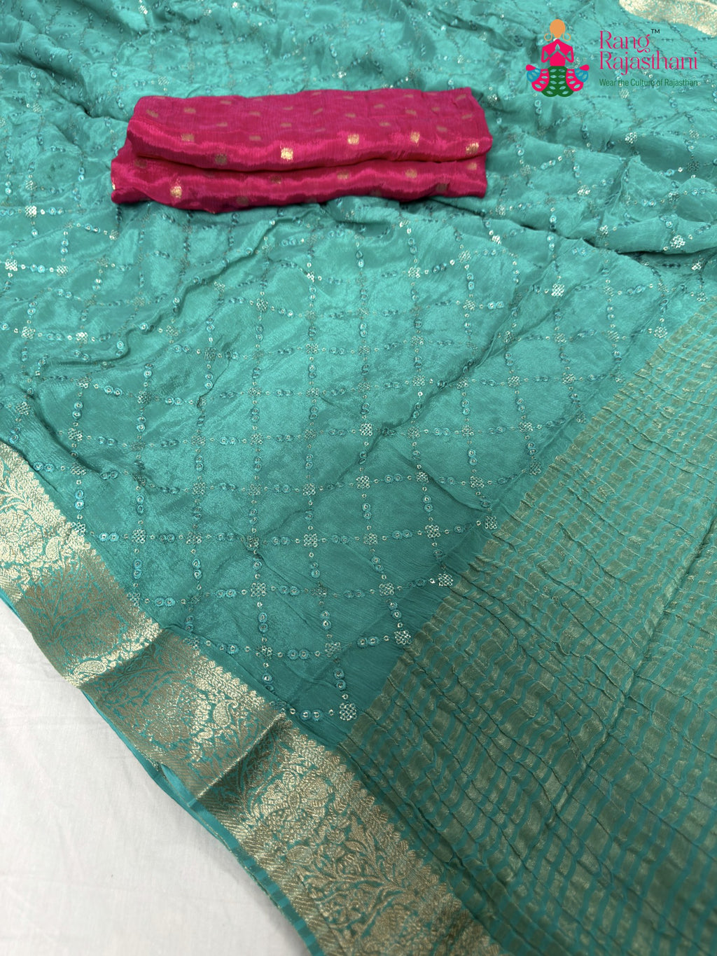 close up detailing of firozi chinnon sequin saree