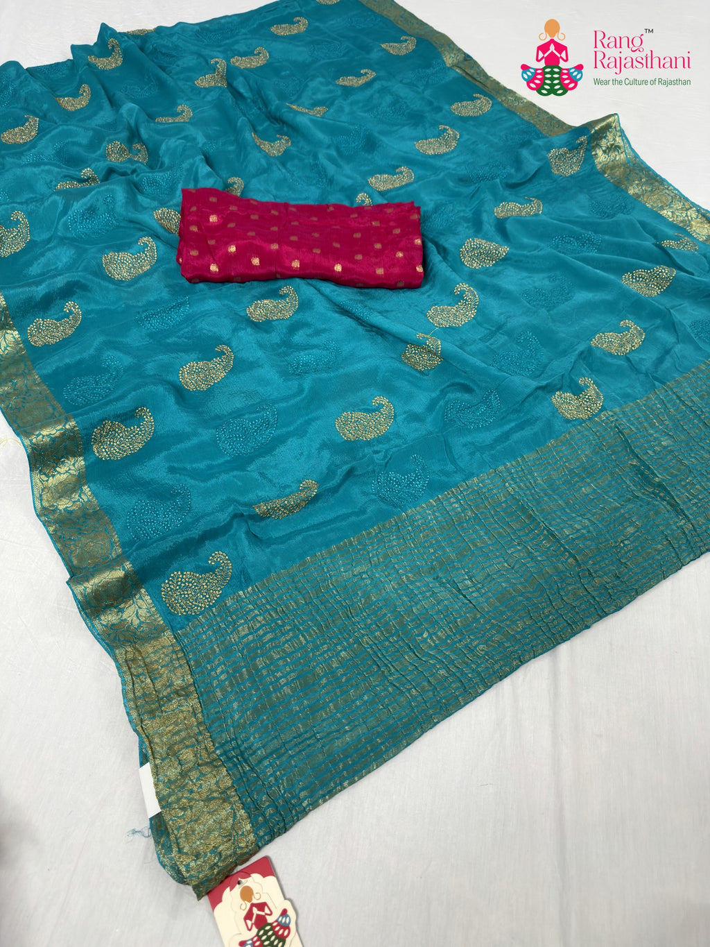pallu detailing of firozi chinnon zari embroidery saree